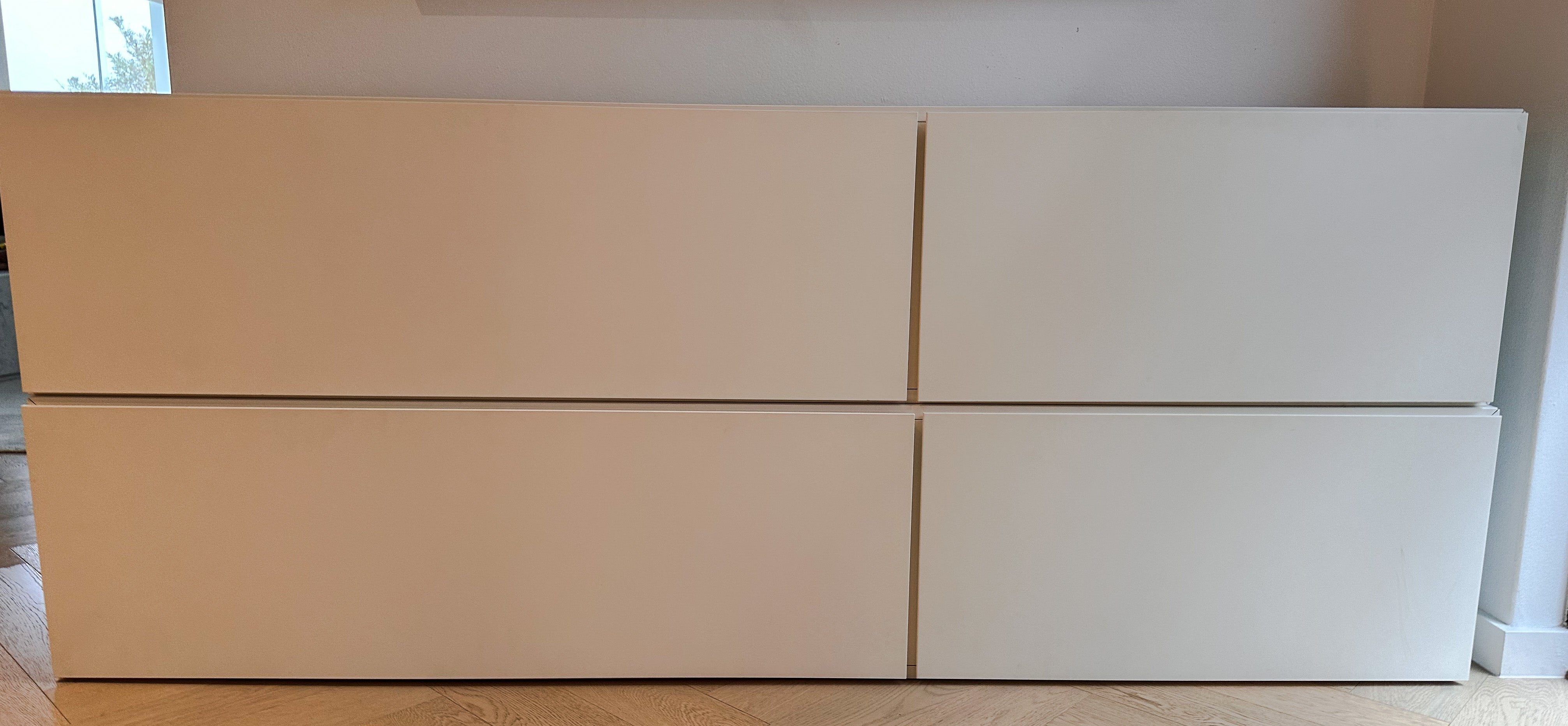 Beige and white storage units against a plain wall