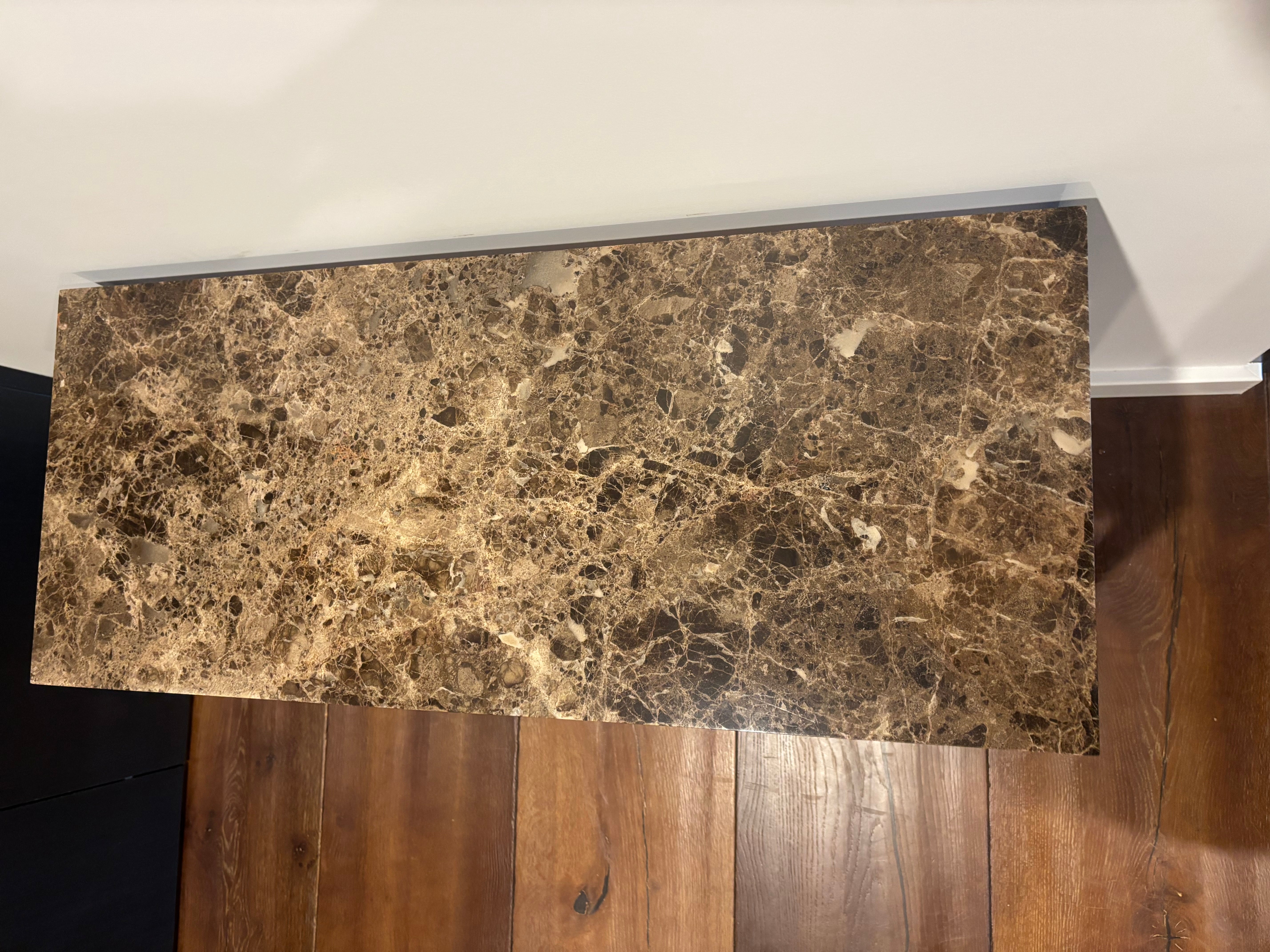 Marble-patterned surface on a wooden floor