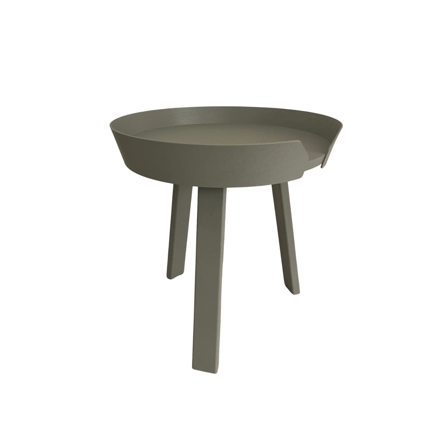 Green side table with a round top and four legs on a white background