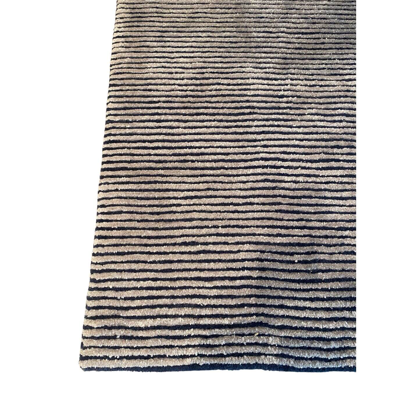 Textured rug with wavy pattern on a white background