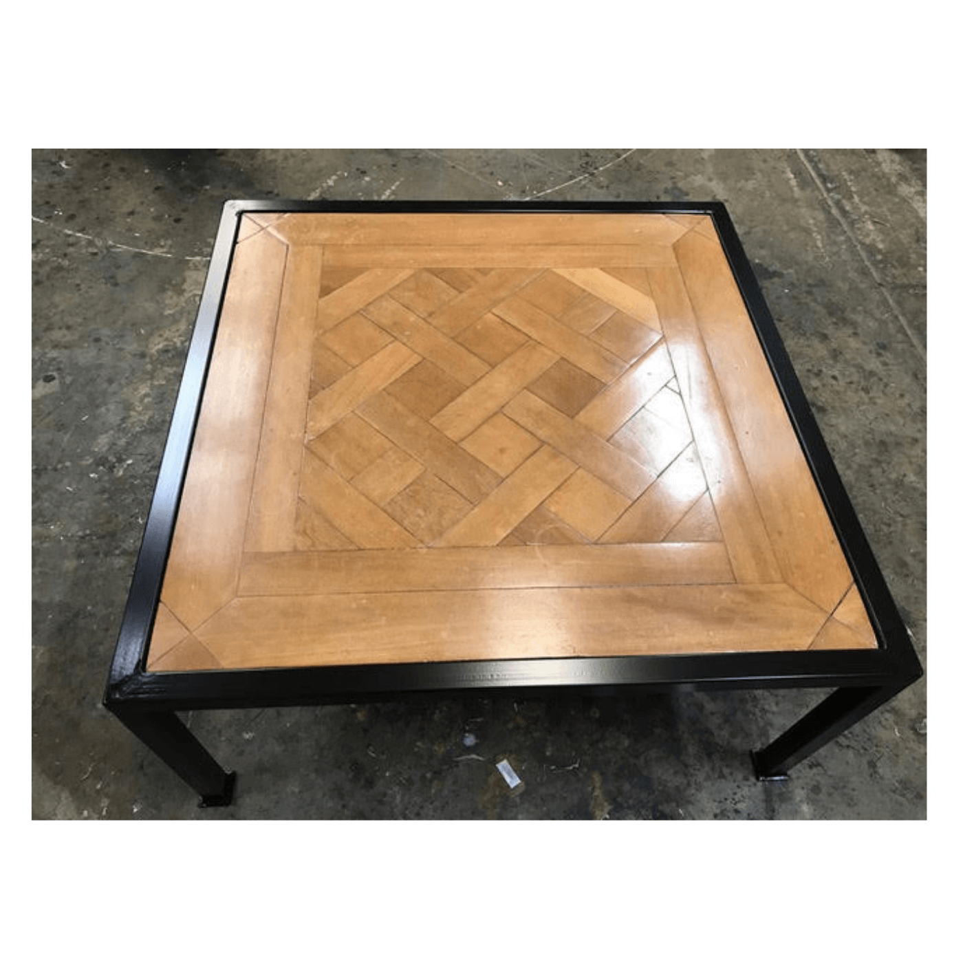 Two Design Lovers Parquetry top coffee table with steel base by The Restoration House