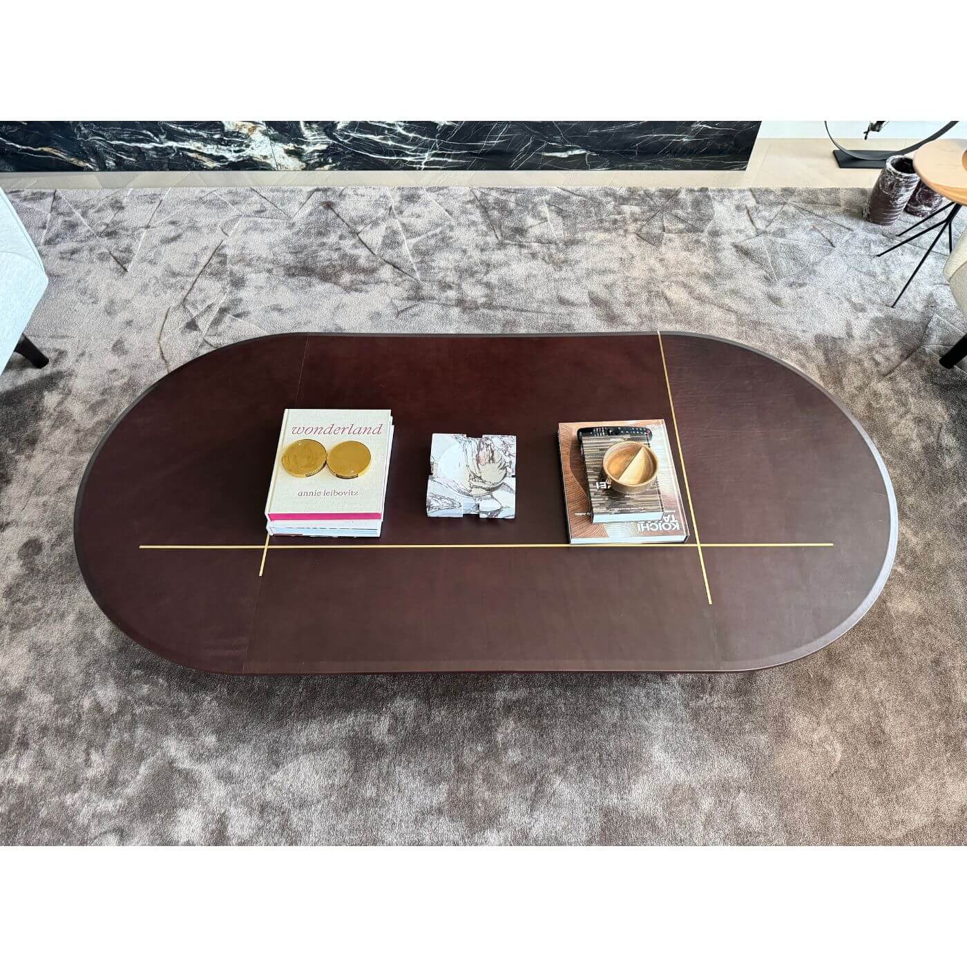 Two-Design-Lovers-Baxter-Leather-and-brass-oval-coffee-table