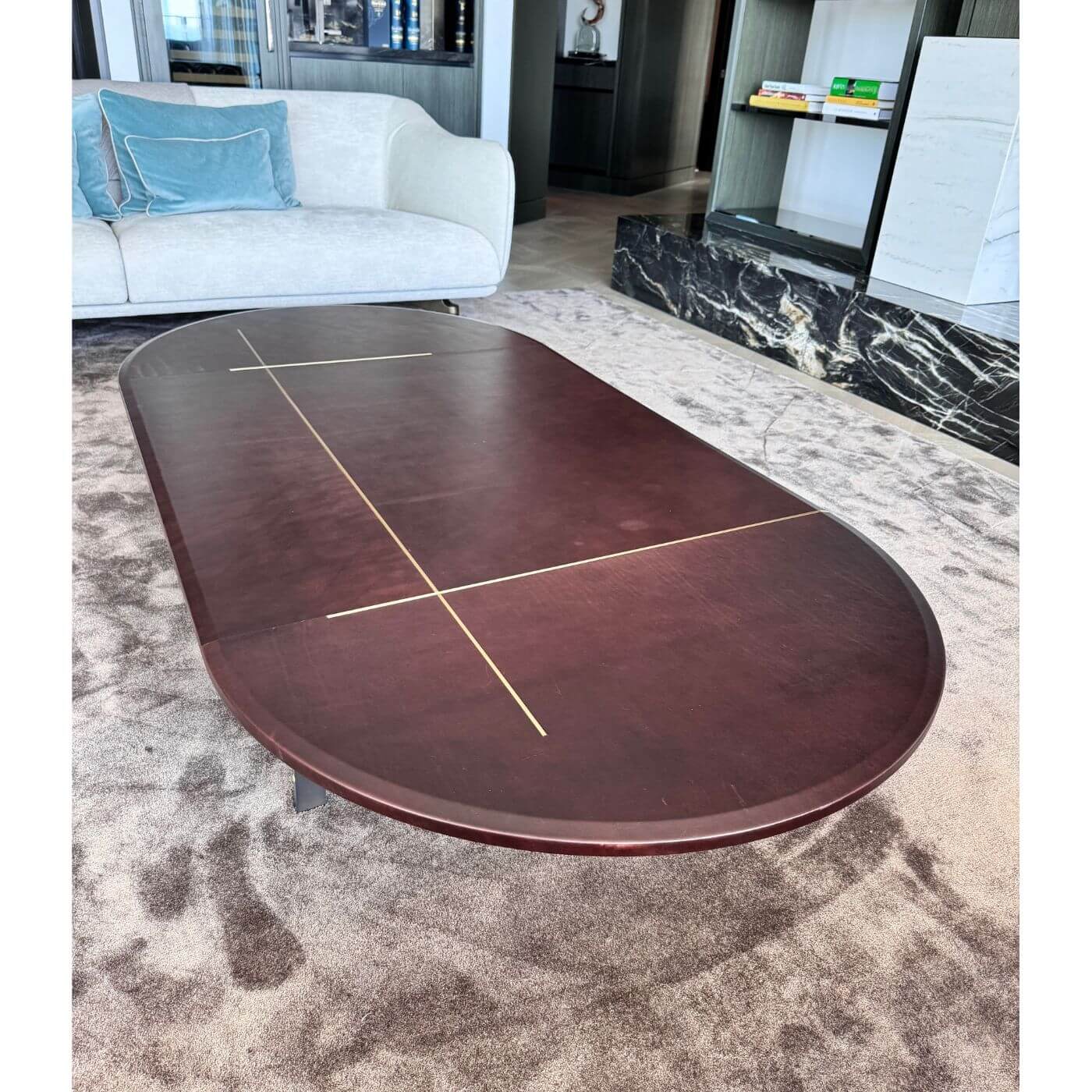 Two-Design-Lovers-Baxter-Leather-and-brass-oval-coffee-table