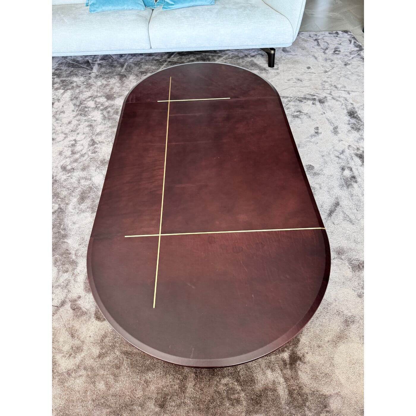 Two-Design-Lovers-Baxter-Leather-and-brass-oval-coffee-table