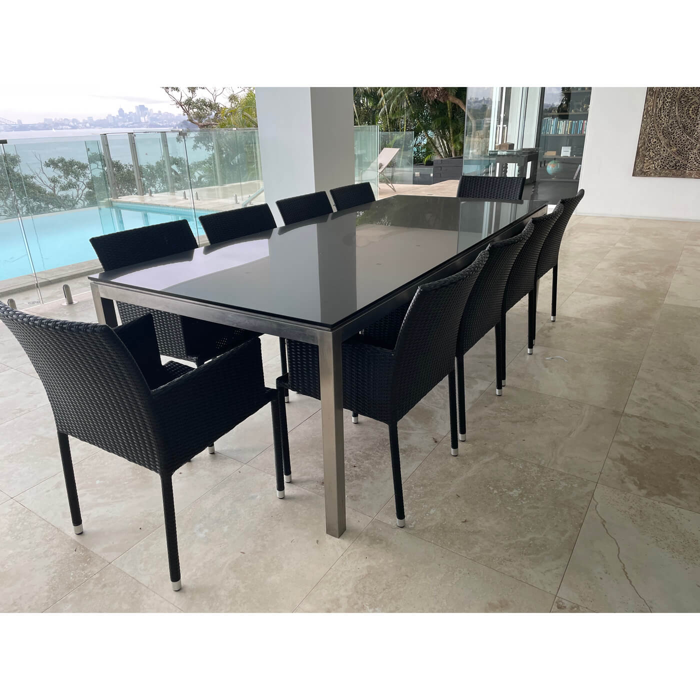 Outdoor dining table with black glass top