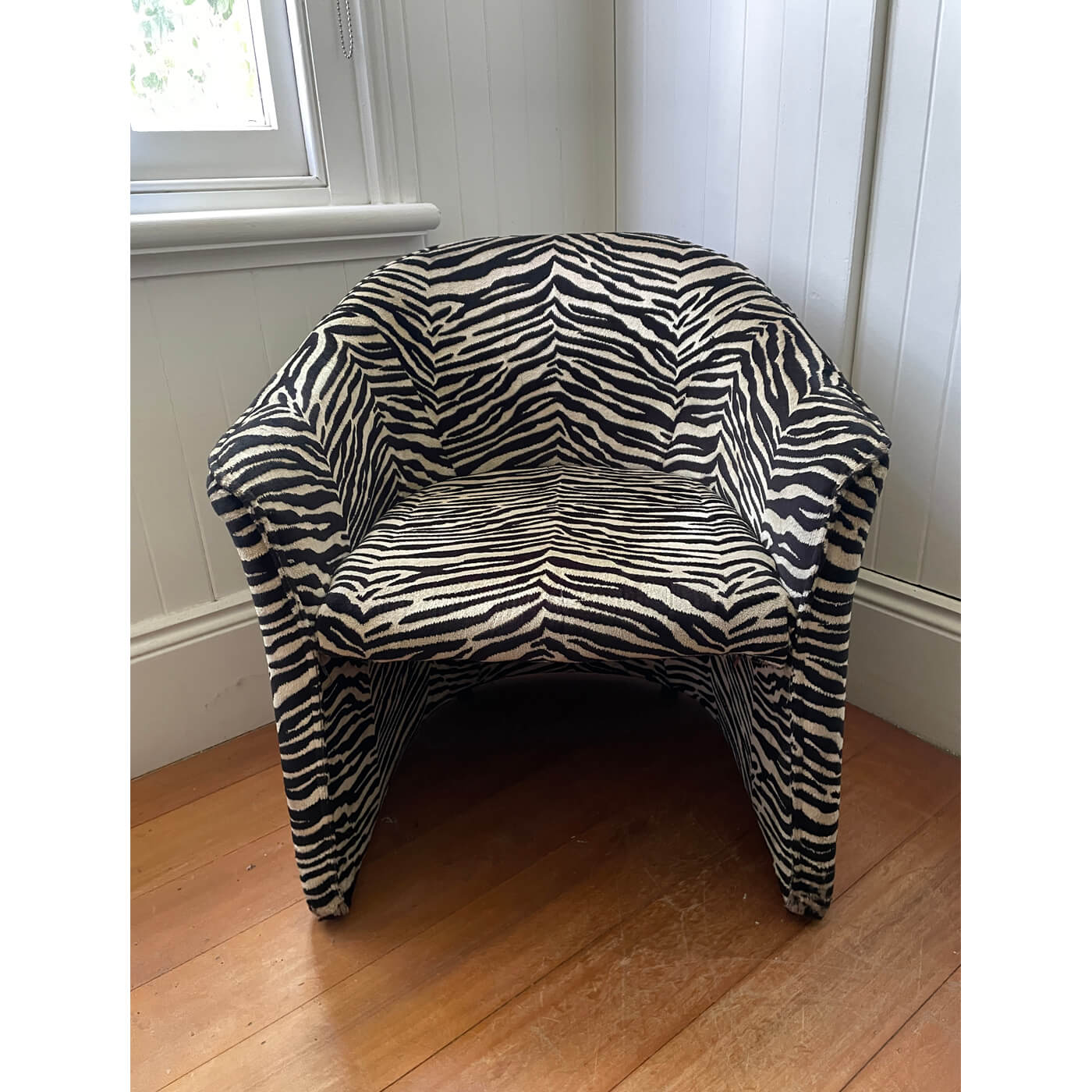 Zebra print tub chairs and ottoman