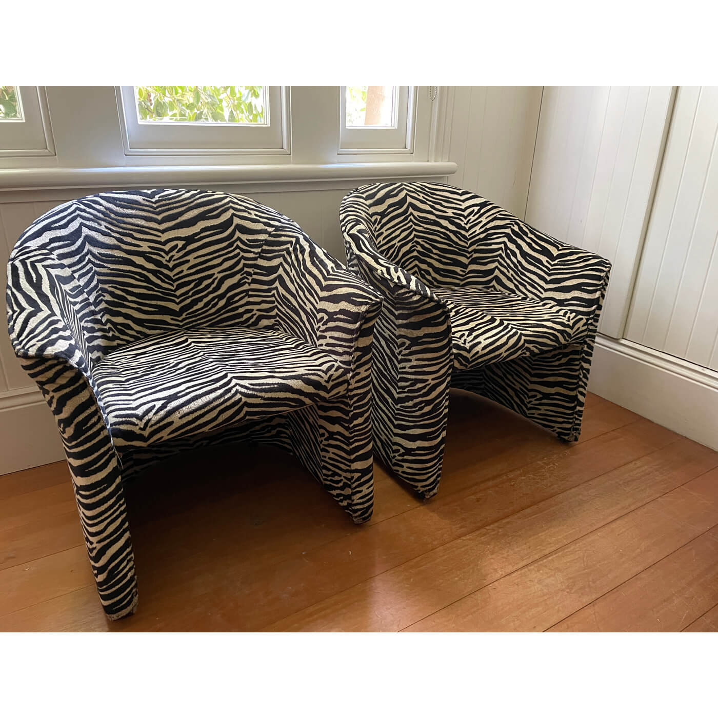 Zebra print tub chairs and ottoman