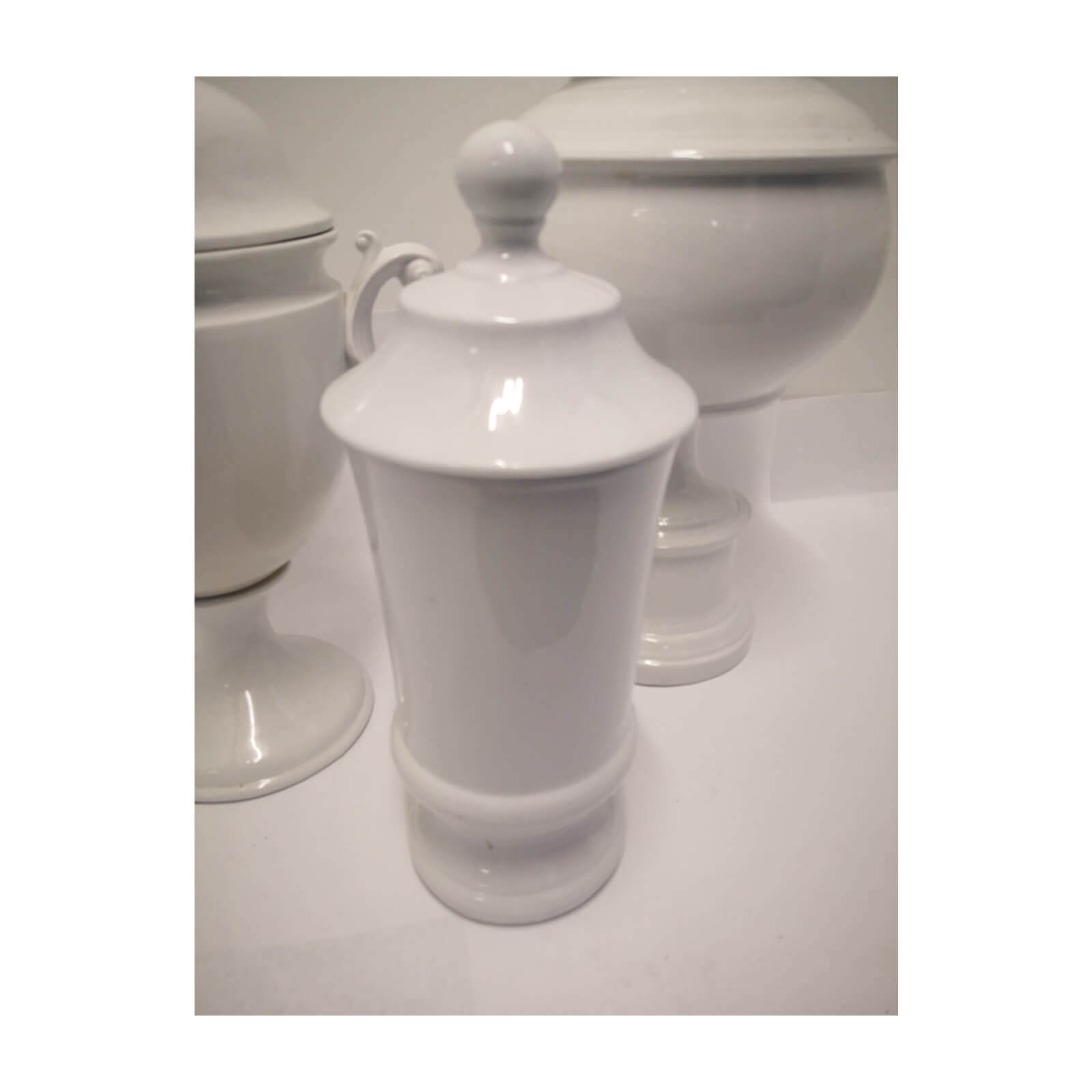 Collection of Lidded White Ceramic Vessels