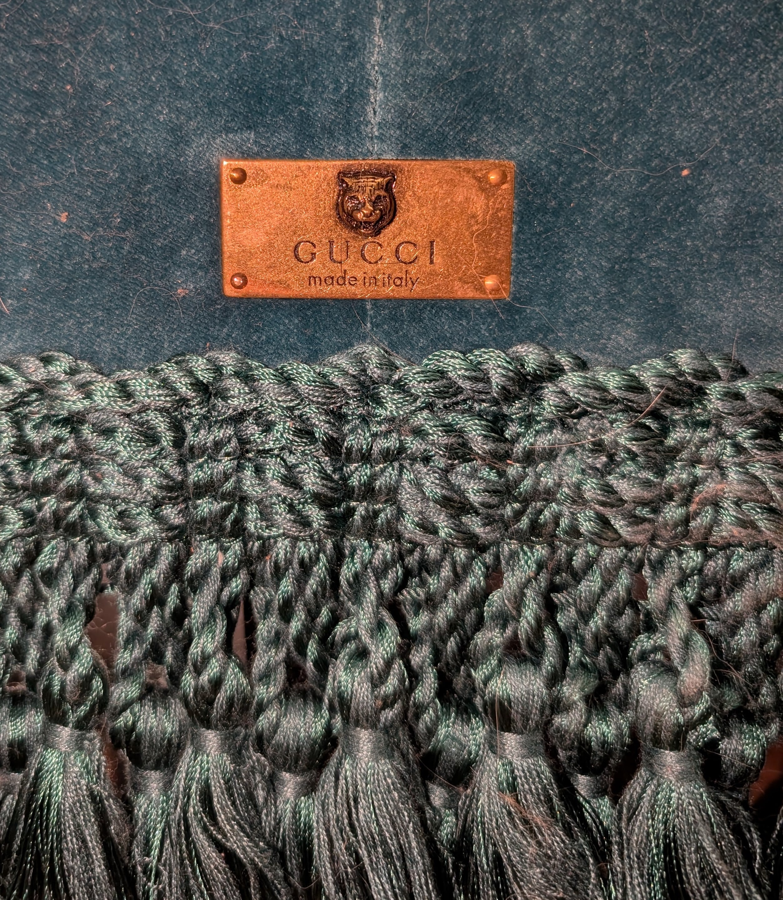 Gucci label on a textured fabric background