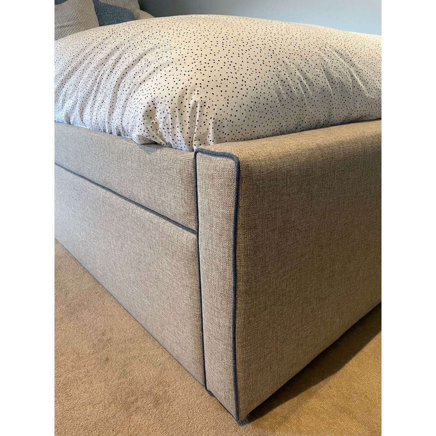 Upholstered single bed with storage drawer