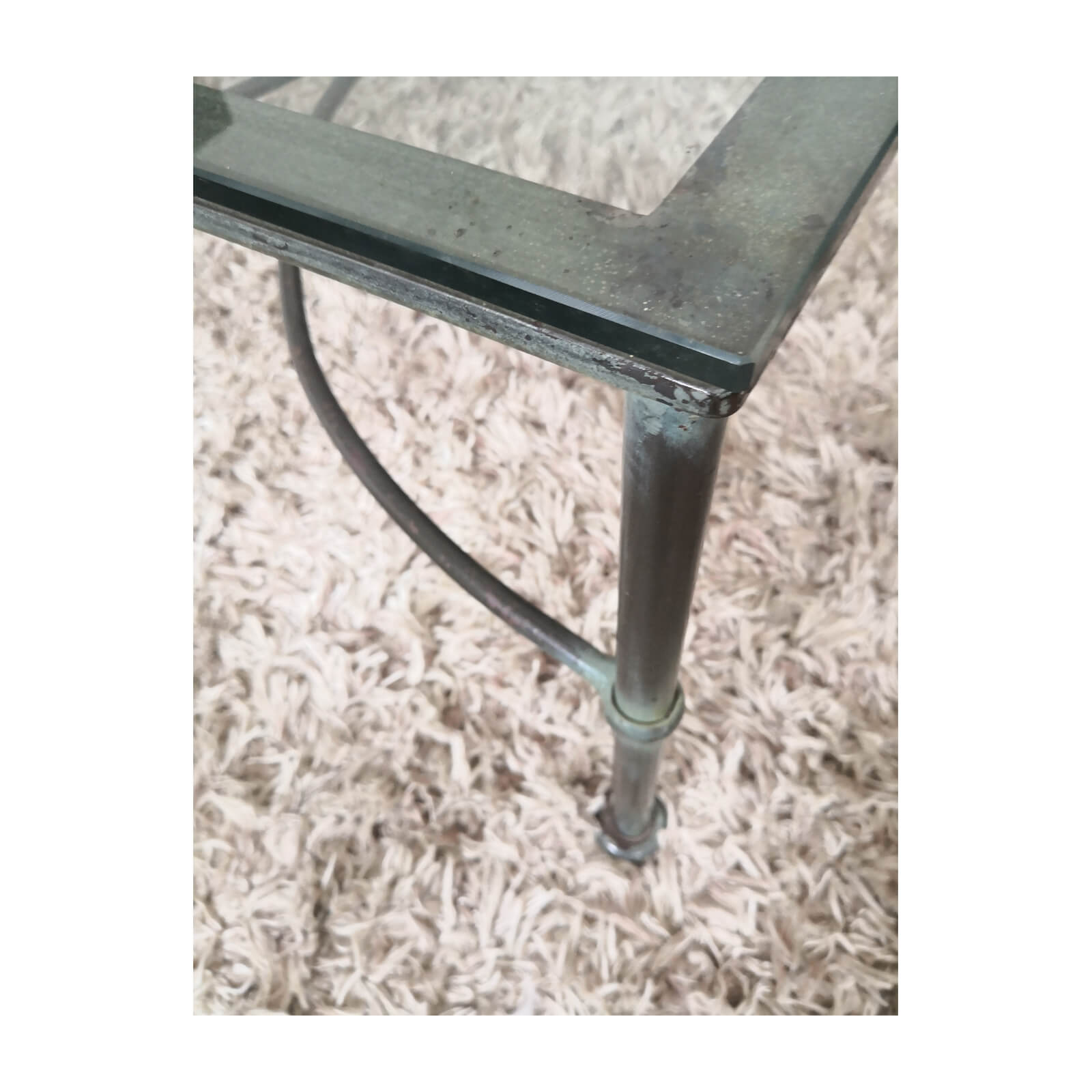 Wrought iron glass topped coffee table leg